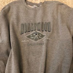 A grey “Hollywood” crew neck